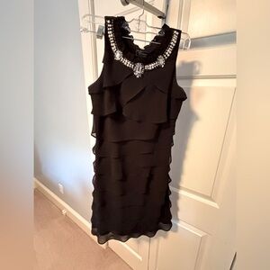 Flirty black victuals dress with pearl and rhinestone neckline.